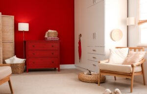 Modern room interior with red chest of drawers